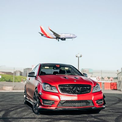 satin candy fire red car wrap mercedes c350 miami airport plane